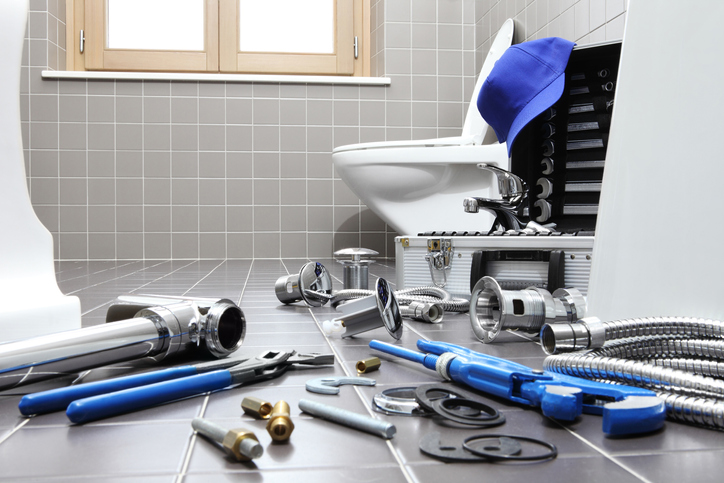 plumber tools and equipment in a bathroom, plumbing repair service, assemble and install