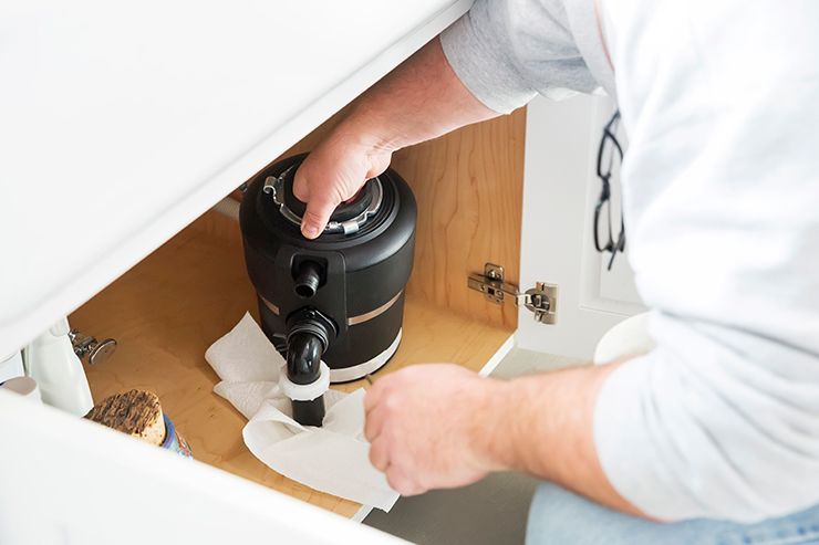Plumber installs a new garbage disposal | Leto Plumbing & Heating, Inc.